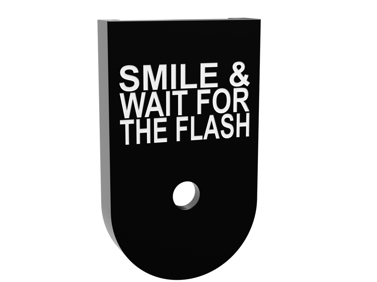 Smile & Wait For The Flash magazine base plate for a Glock 43X magazine, shallow white marking on black Cerakote