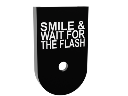 Smile & Wait For The Flash magazine base plate for a Glock 43X magazine, shallow white marking on black Cerakote